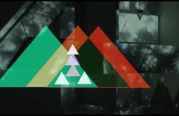 Digital coloured triangular patterns are imposed over footage a sculpture installation featuring the same shapes.