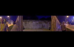 Three screen footage of a man walking along a footpath beside a large concrete wall with an empty road beside him.