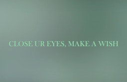 A blurry screen of leaf green has the text 'Close ur eyes, make a wish' written overtop.