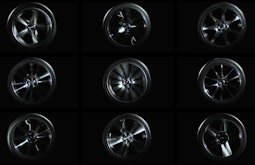 Nine car wheels spin positioned in a grid formation.
