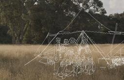 A dry grassy field with large green trees in the distance. An outline drawing in white of a group of people and a tent is super-imposed.