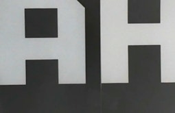 Large white letters A and H.