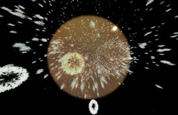 An orange orb floats in black space, firework's shoot out from the centre.