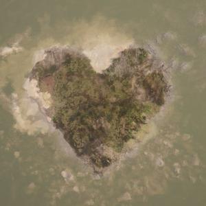 A heart-shaped island seen from above in a grey-green sea