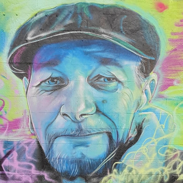 A spraypainted mural of Martin Rumsby