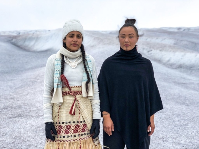 Kathy Jetñil-Kijiner and Aka Niviâna stand side by side in a icy white landscape with serious expressions