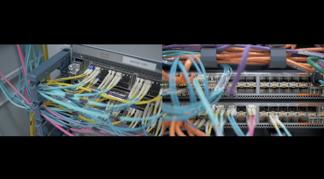 A close up of colourful input wires in a server bank