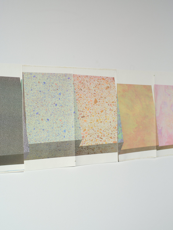 A series of prints resembling marbled end papers or colourful biological abstractions.